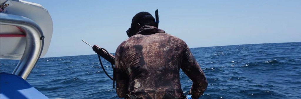 man getting ready to go spear fishing